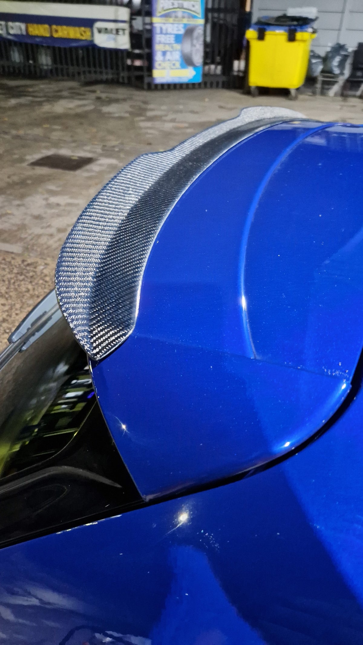 Custom My Ride carbon fibre lip spoiler installed on a blue Seat Leon 5F hatchback for a sporty look