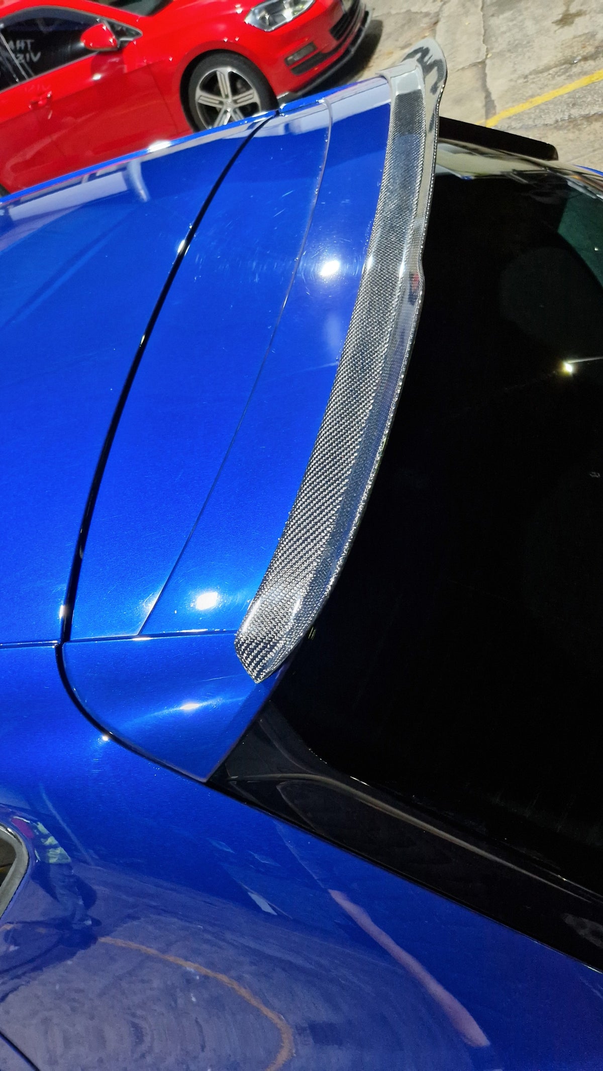 Custom My Ride carbon fibre lip spoiler installed on the rear roof of a blue Seat Leon 5F hatchback