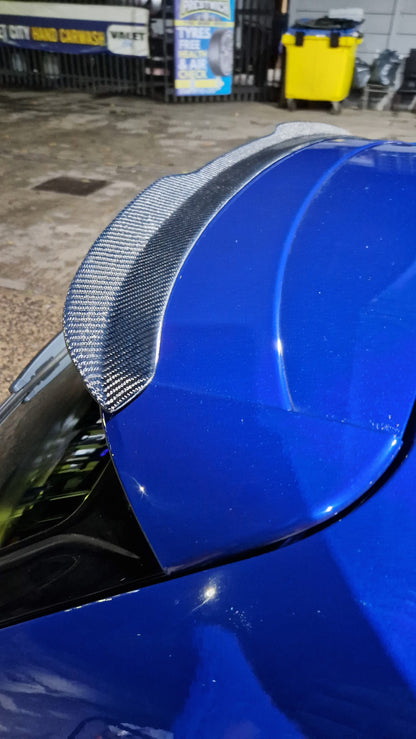 Custom My Ride carbon fibre lip spoiler installed on a blue Seat Leon 5F hatchback for a sporty look